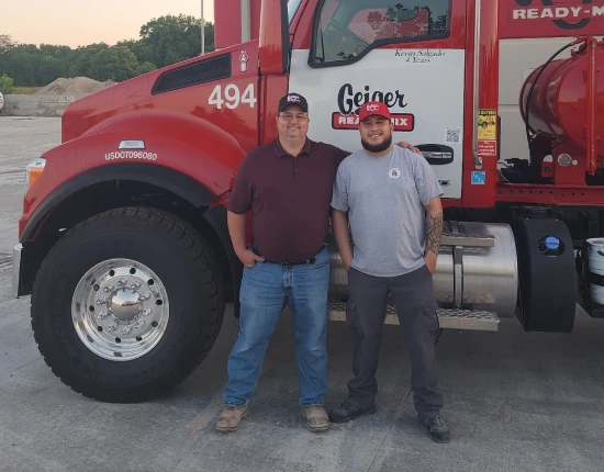 Team standing in front of Geiger truck